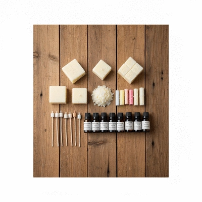 Arrangement of high-quality candle making supplies such as premium wax, wicks, and essential oils on a rustic wooden table, bright lighting, no text, no words, no typography, clean image